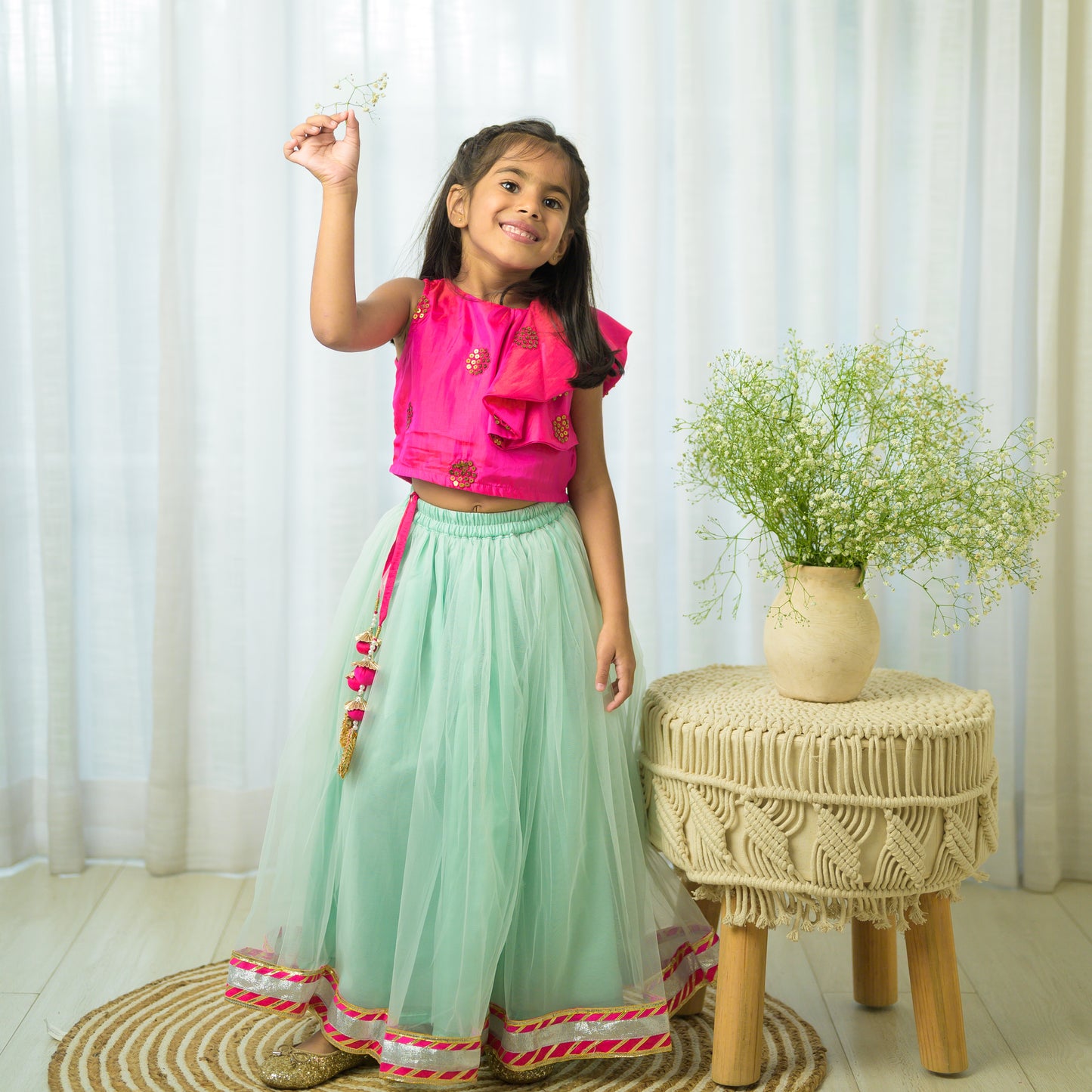 Hot Pink Ruffled Top With Green Net Lehenga