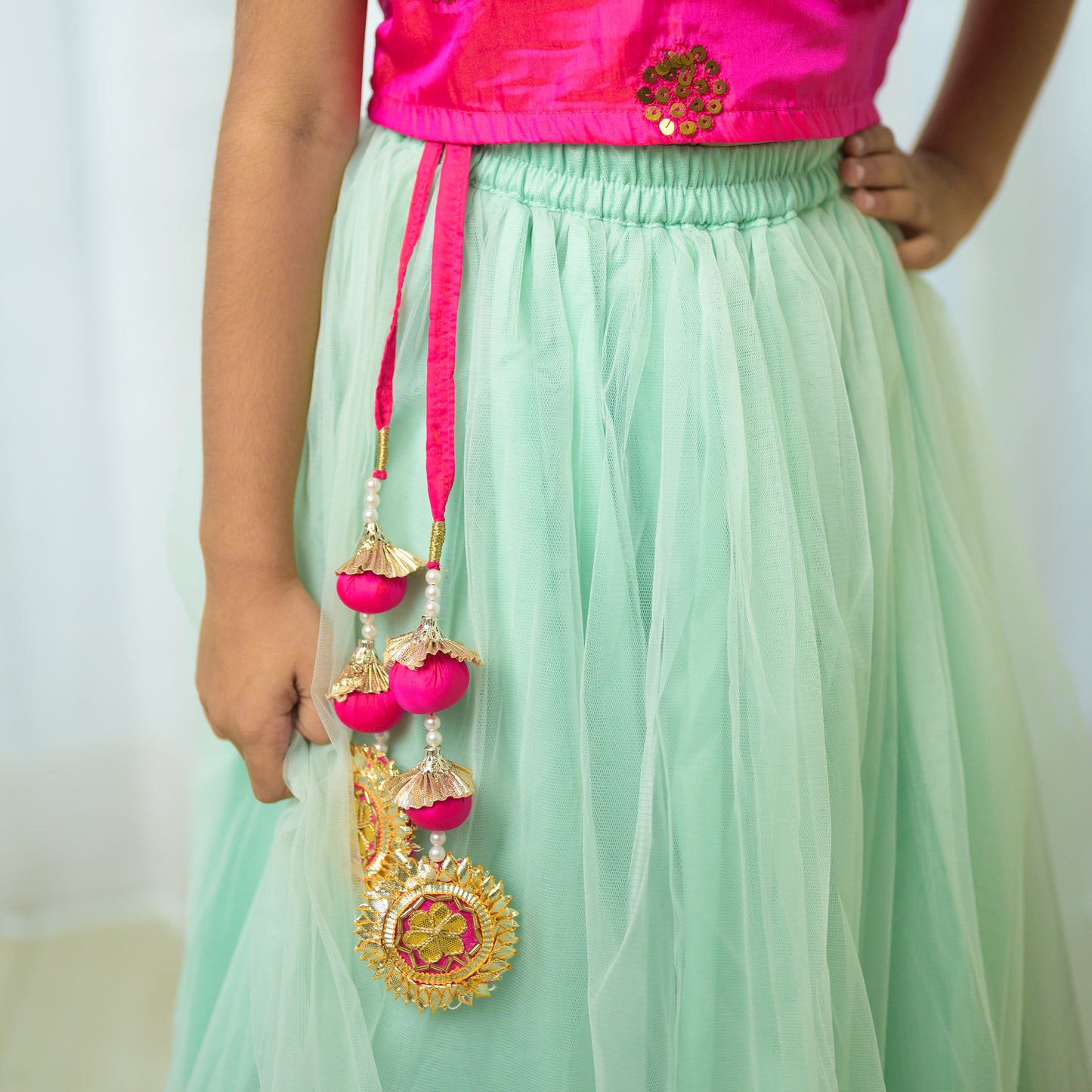 Hot Pink Ruffled Top With Green Net Lehenga